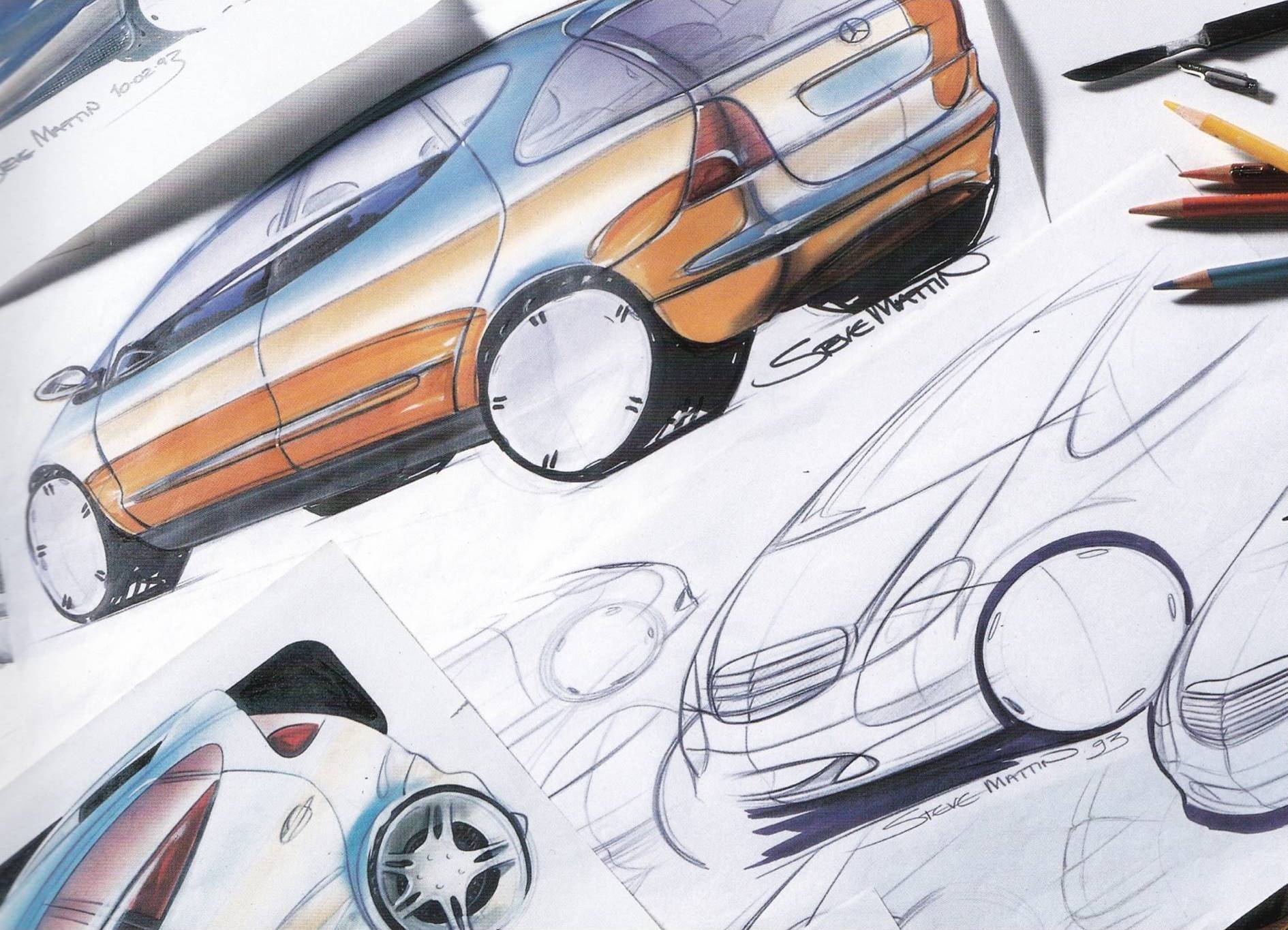 Spread papers with sketches of cars in color and as line drawing